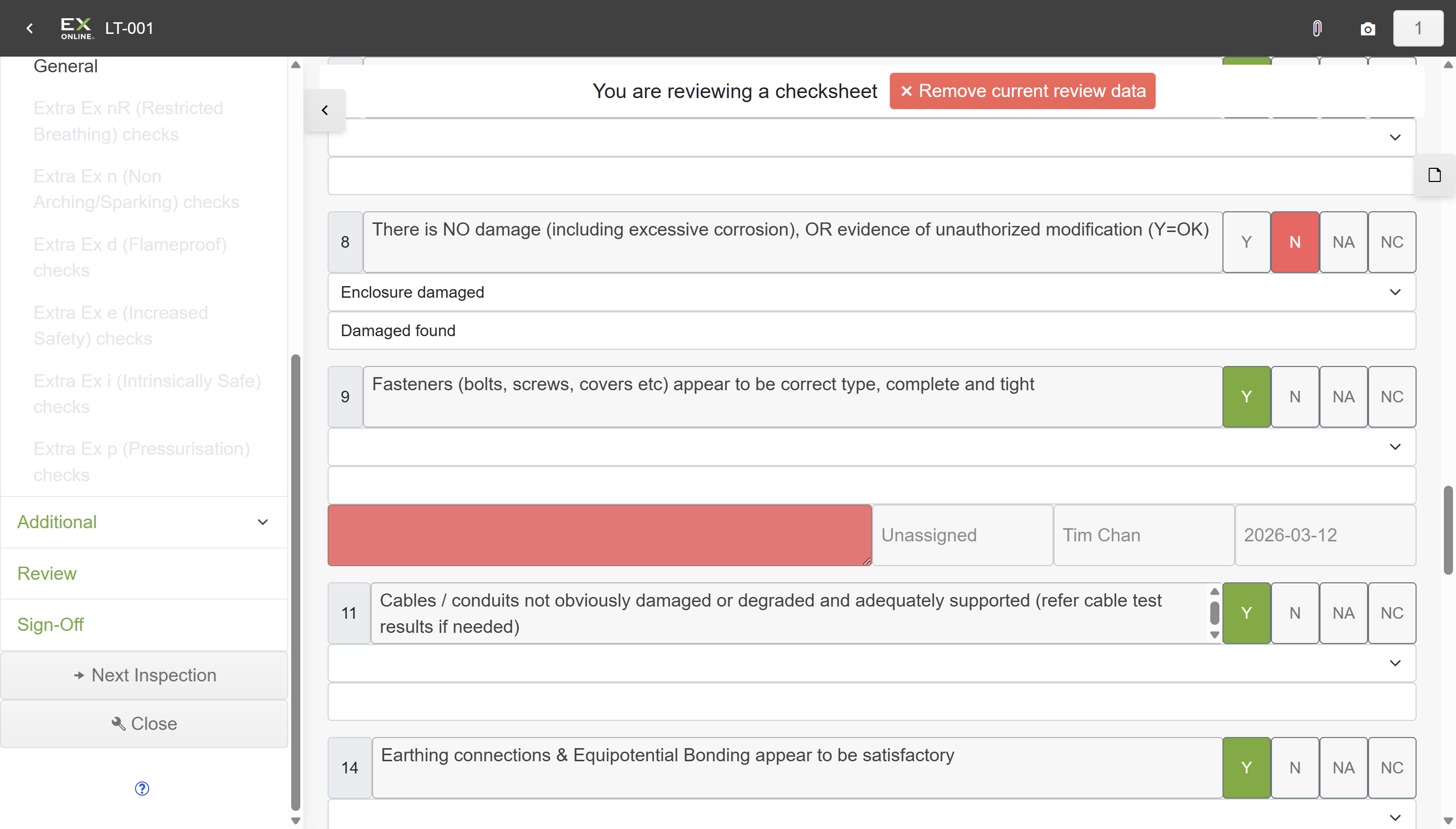 Check sheet in review mode — orange bar shows reviewing status, question 8 still marked N